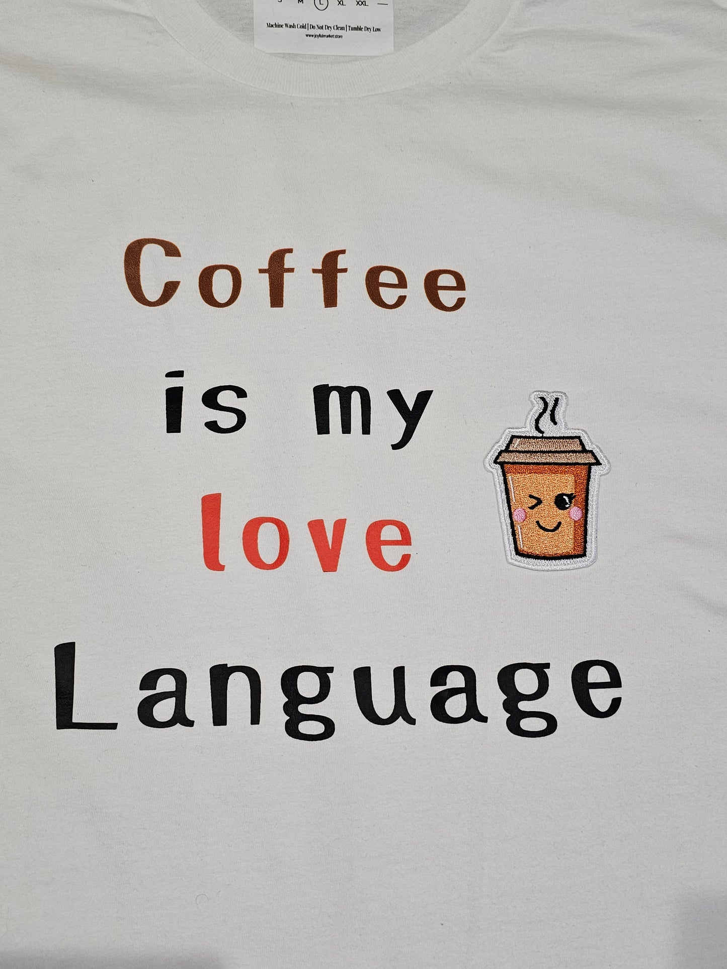 "Coffee is my love Language" loose fit t-shirt with a unique twist of a embroidered coffee cup patch.