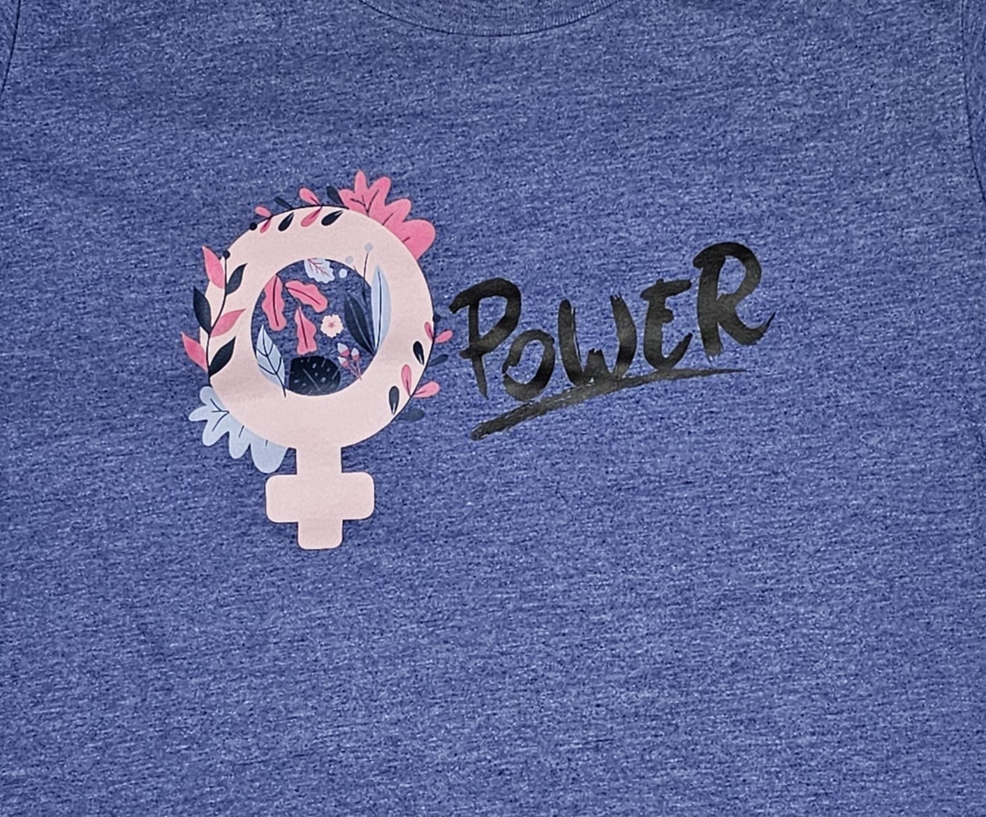 "Female Power" t-shirt with hand-stitched on the sleeves adding a artisanal detail.