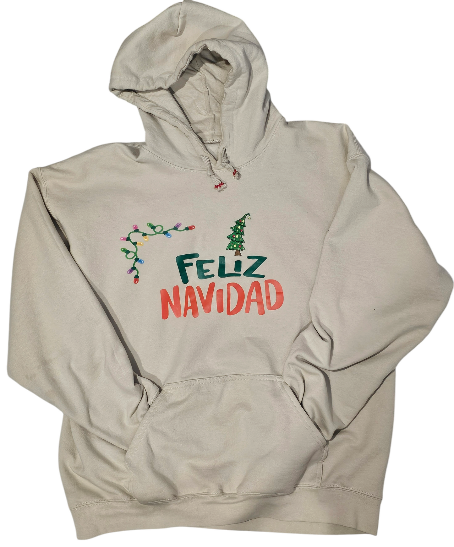 Feliz Navidad Hoodie, soft material featuring an embroidered xmas tree patch is the perfect blend.